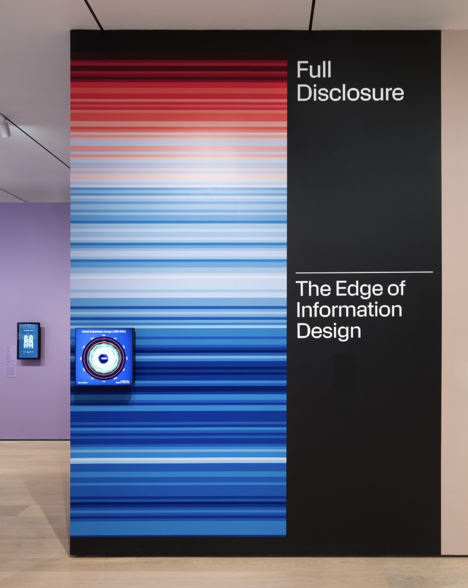 The Full Disclosure: The Edge of Information Design title wall at MoMA, printed with climate warming stripes.